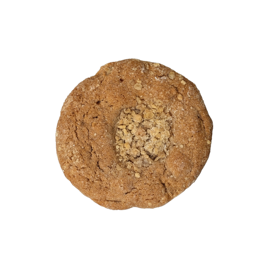 Picture of a cookie stuffed with spiced apple pie filling and topped with crumble.