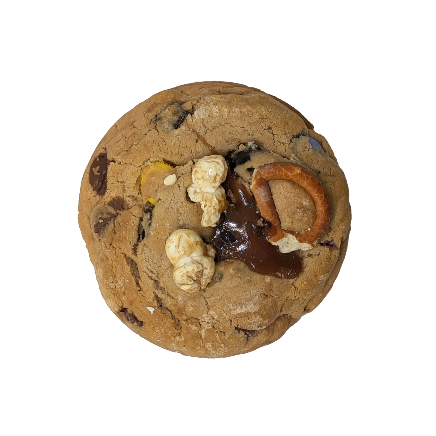 Picture of a cookie stuffed with soft caramel and topped with popcorn, pretzels and toffee.