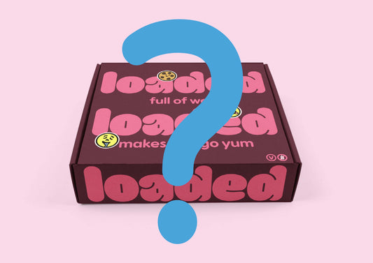 Loaded box with a blue question mark on a pink background