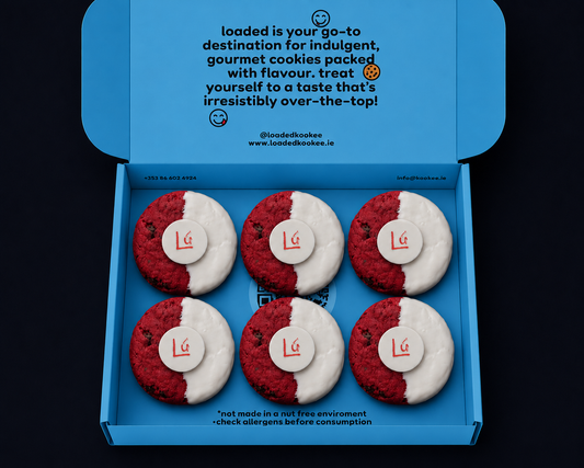 An open bright blue box of six round cookies arranged in two rows of three. Each cookie is split vertically into red and white halves, with a small white center circle printed with the red logo 'Lú'.